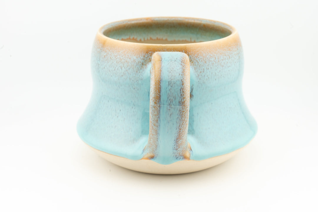 Curvy wide mug, light aqua blue ceramic with rectangular back handle and speckled glaze