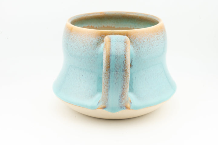 Curvy wide mug, light aqua blue ceramic with rectangular back handle and speckled glaze