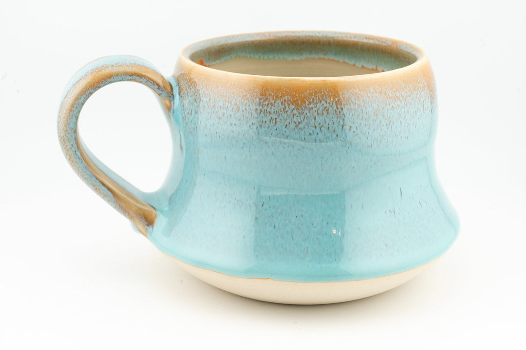 Curvy wide mug, light aqua blue ceramic with loop handle and speckled glaze finish