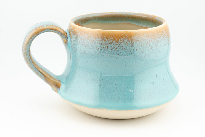 Curvy wide mug, light aqua blue ceramic with loop handle and speckled glaze finish