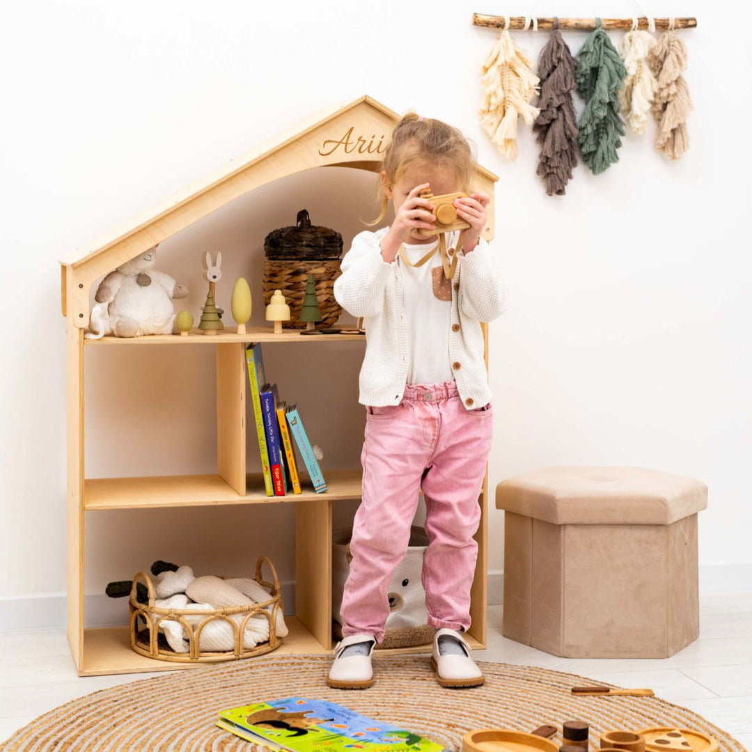 Wood dollhouse bookcase with arched top and toys, personalized "Aria", child playing