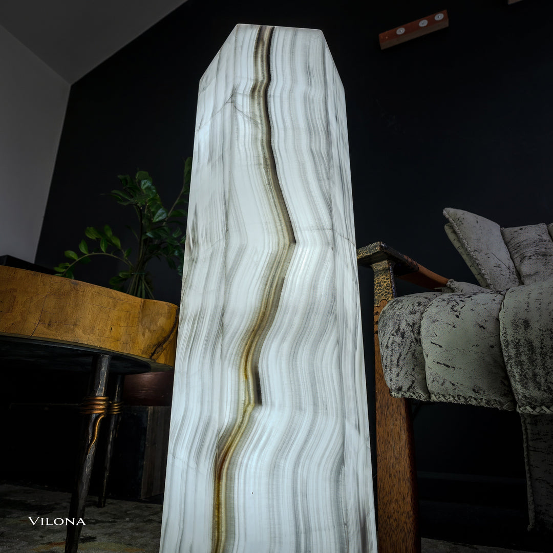White onyx floor lamp angled view, hexagonal column shade with vertical striations