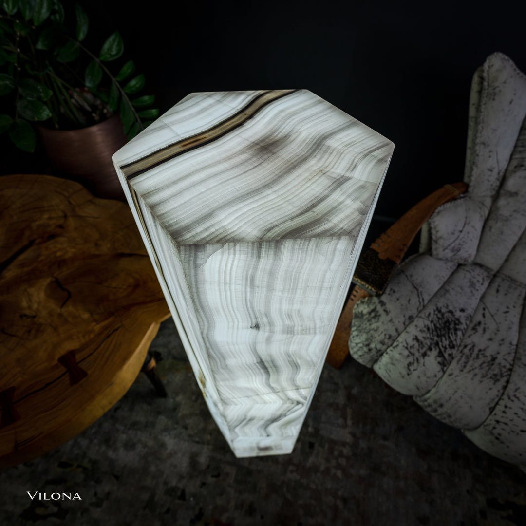 White onyx floor lamp angled view, hexagonal prism shade with layered vertical swirls