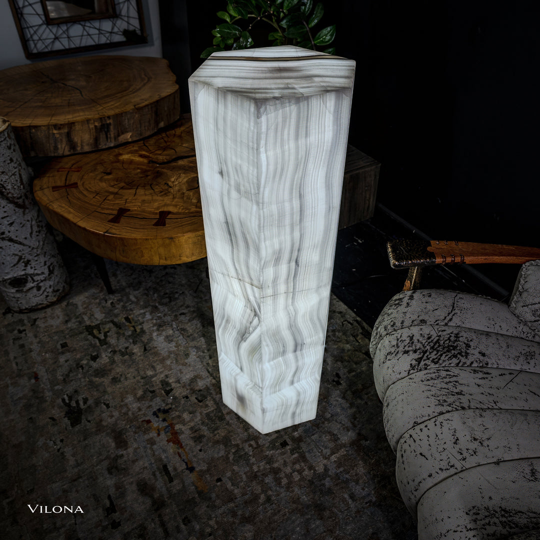 Small white onyx floor lamp with tall faceted column and vertical vein pattern