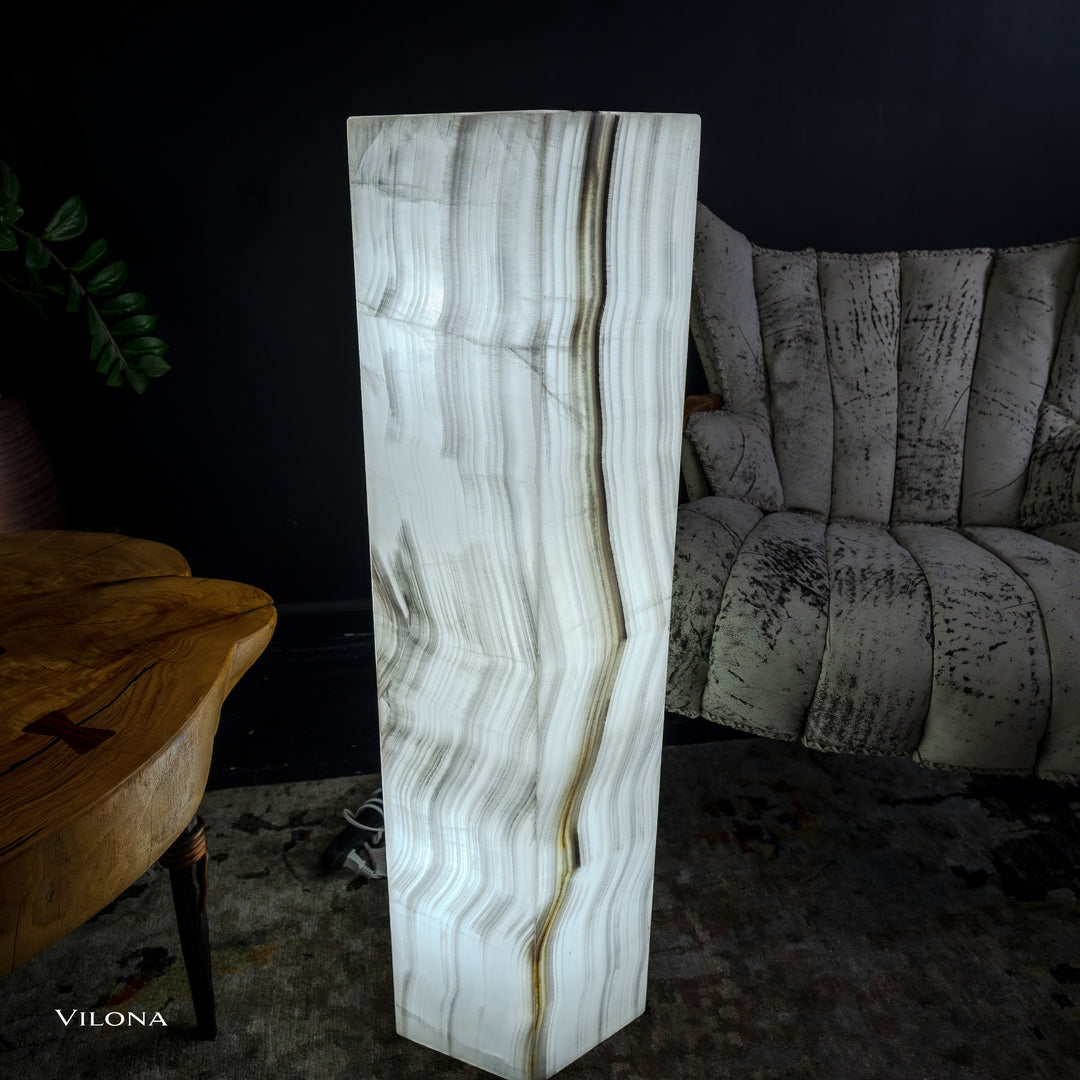 White onyx floor lamp side view, hexagonal shade with vertical veining and bands