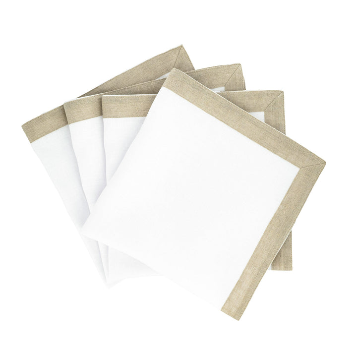 Set of linen napkins with white centers and tan sparkle borders, stacked.