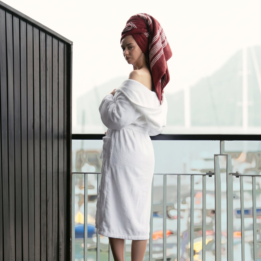 White unisex bathrobe with hood and waist belt, long sleeves, knee-length terry