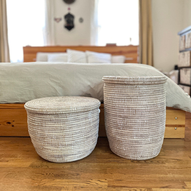Round woven floor baskets with flat lids, two sizes, light neutral weave