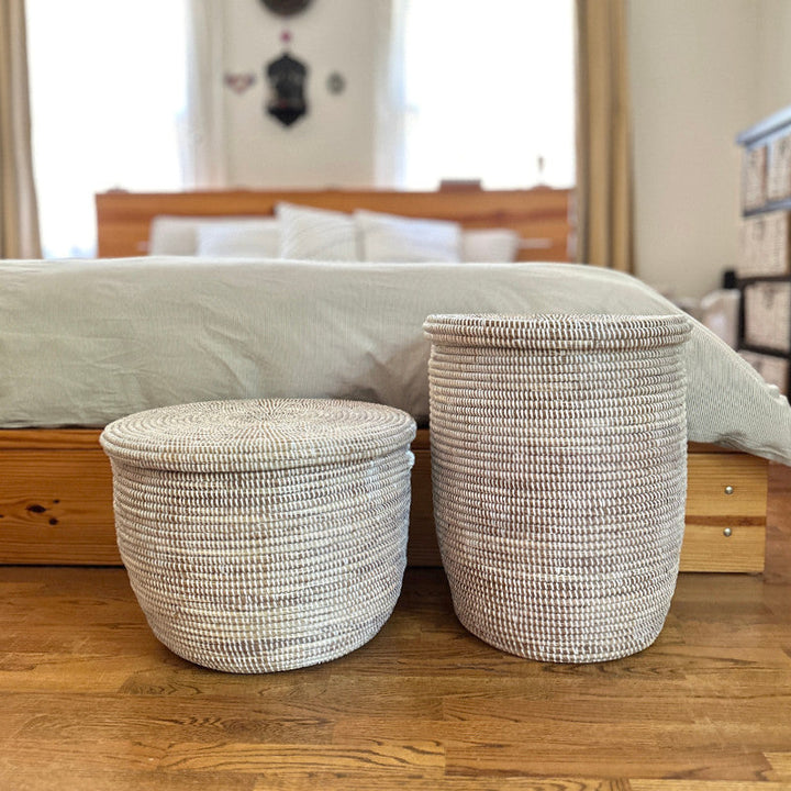 Round woven floor baskets with flat lids, two sizes, light neutral weave