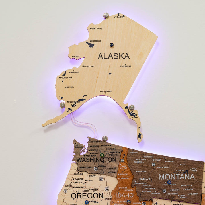Wooden USA LED wall map with tan states, purple light outline, and metal mounting pins.