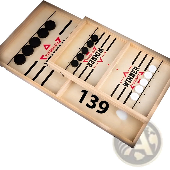 Wood desktop puck game board with black and white discs in divided lanes