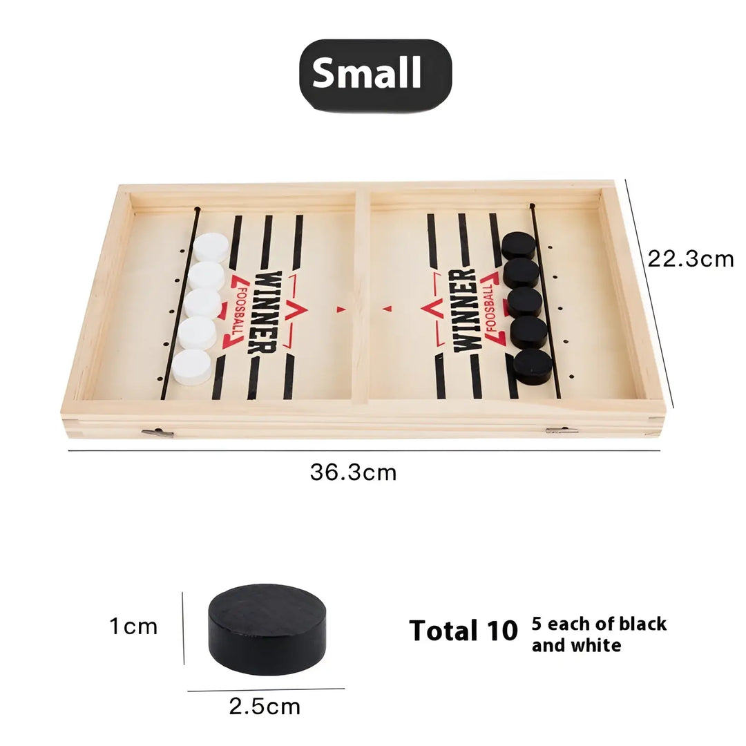 Small desktop puck game board with black and white discs in two playing lanes