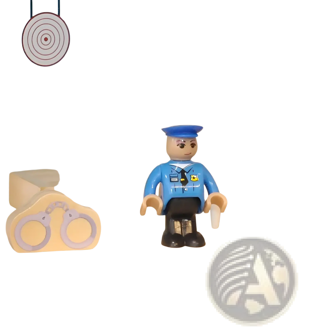 Police officer toy figure with hat, handcuffs accessory, and round police badge emblem