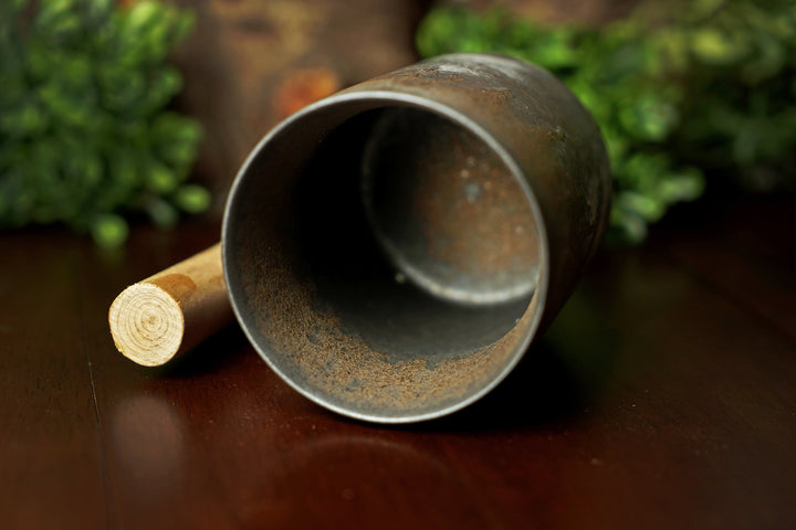 Glazed ceramic mug with wooden handle, top opening visible, iron bronze glaze
