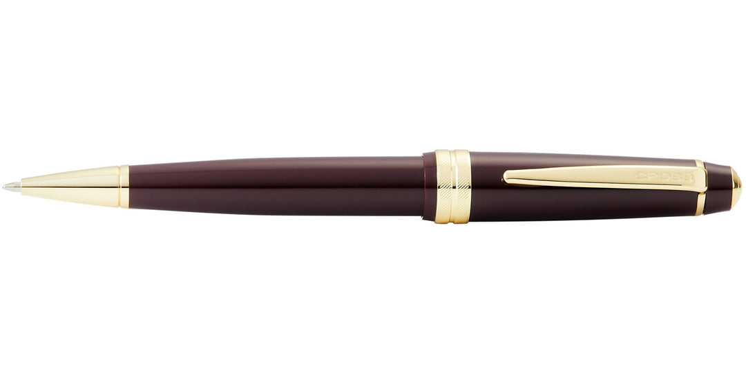 Burgundy resin ballpoint pen with gold-tone center rings and matching tip