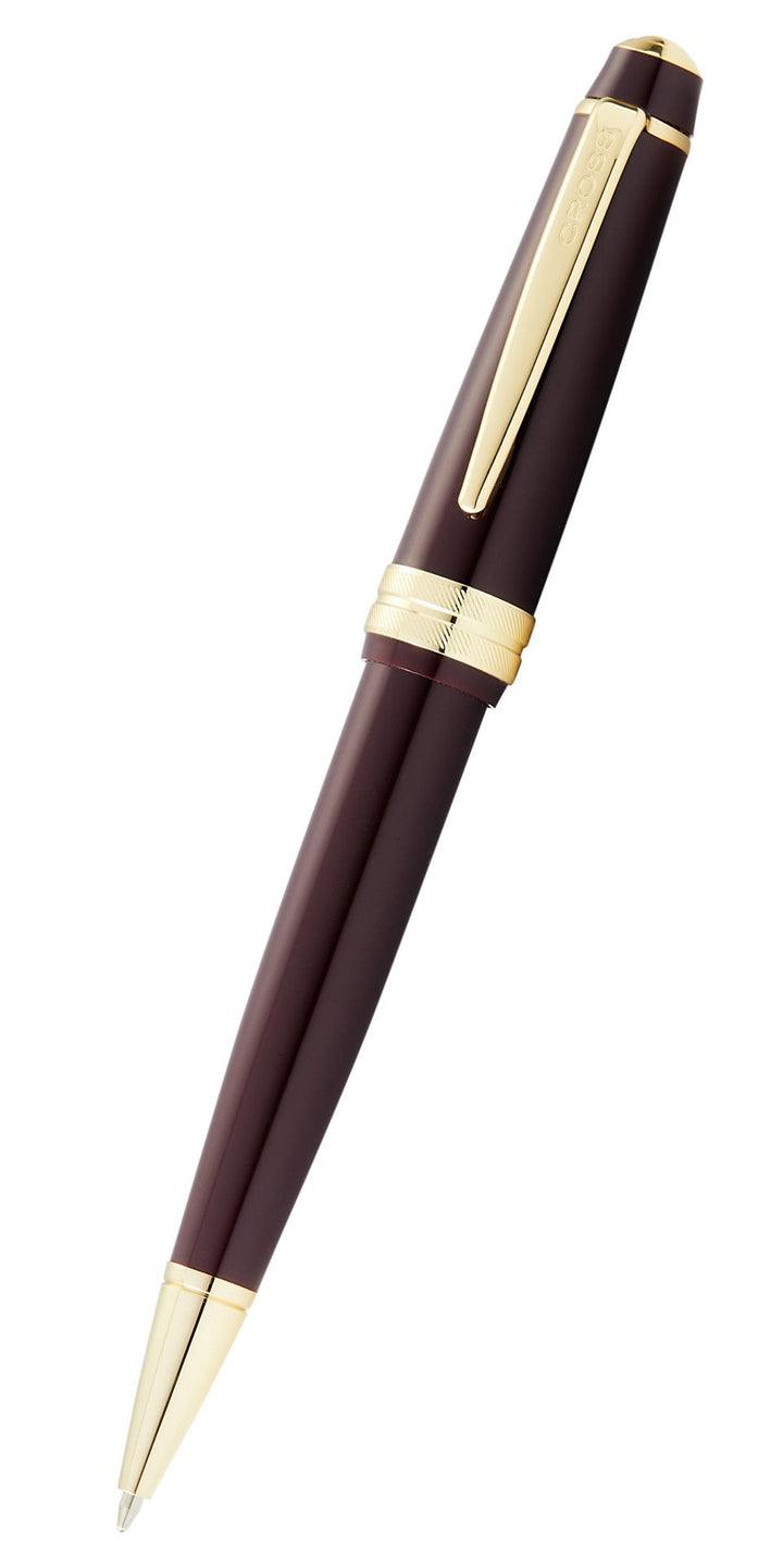 Burgundy resin ballpoint pen with gold-tone clip and polished barrel accents