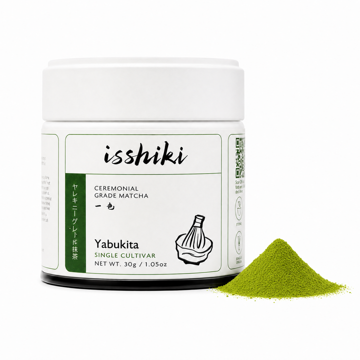 Ceremonial matcha tin with white lid and Yabukita label; loose green matcha beside it
