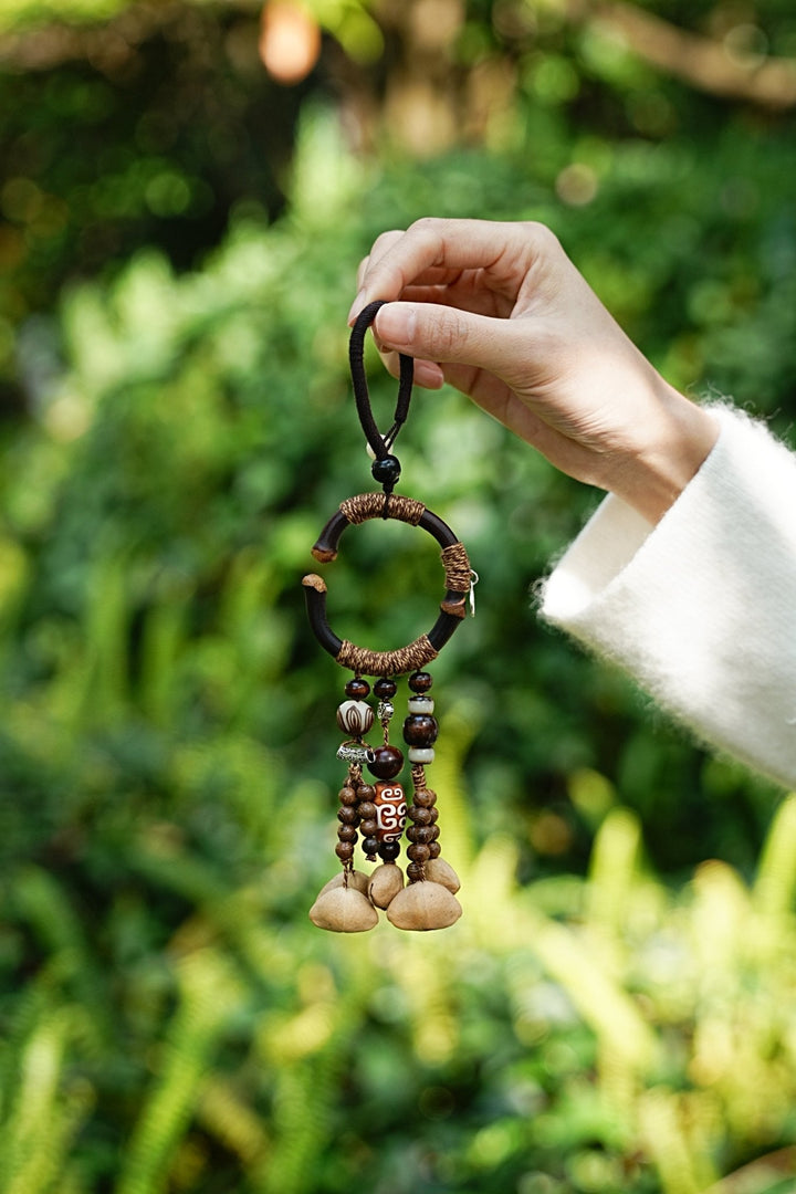 Beaded seed bag charm with curved ring and small wooden beads