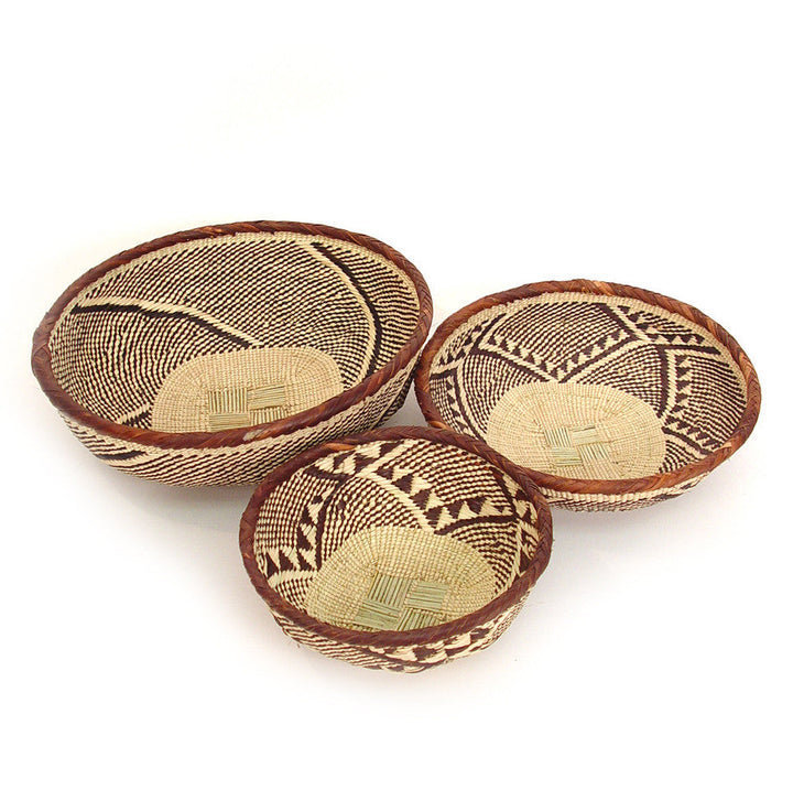 Woven basket bowl set: three round bowls in tan with dark geometric patterns